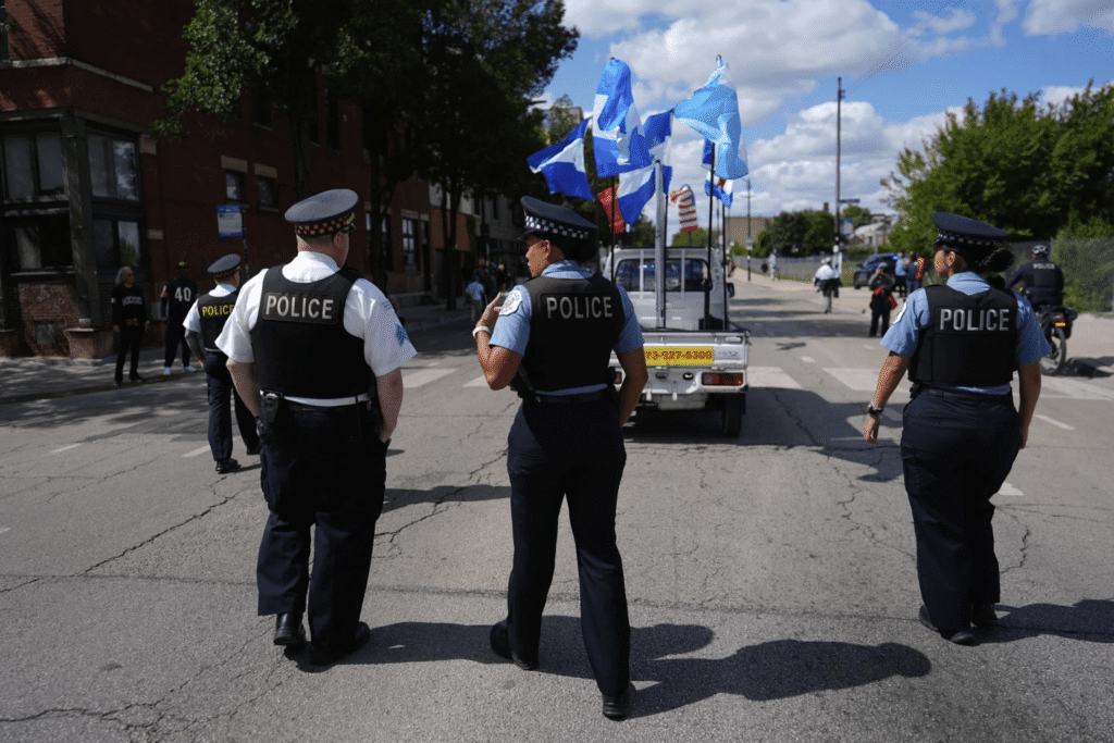 Police walk the route during the 2025 Pilsen Mexican Independence Day Parade Sat, Sept. 6,2025