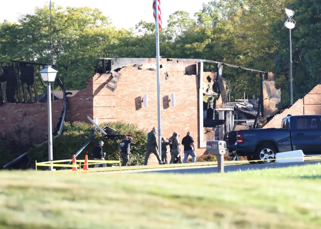 Officers walk outside the Church