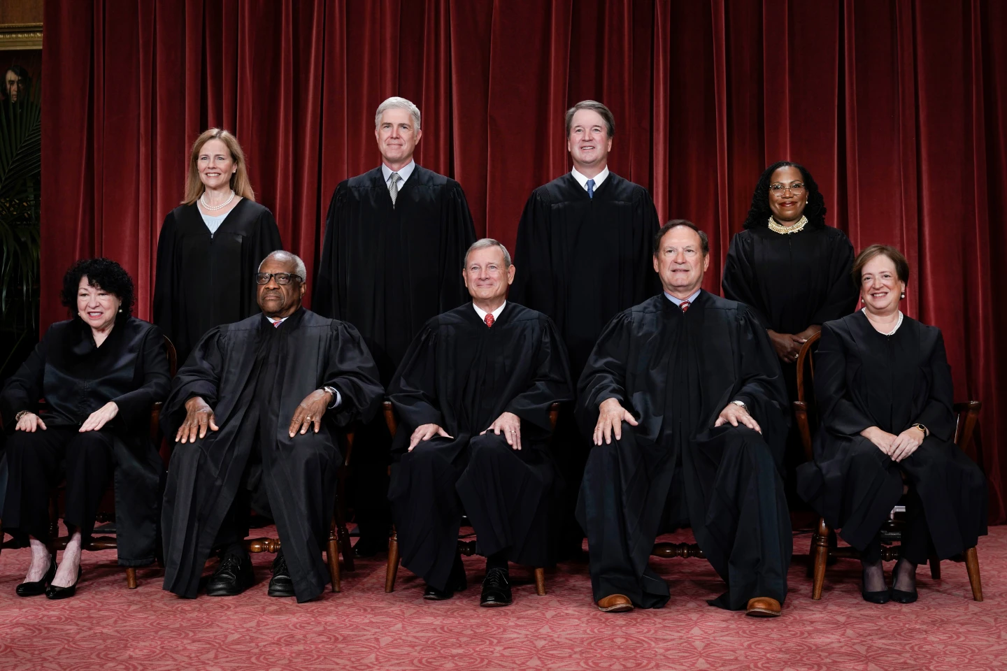 Members of the Supreme Court sit for a new group portrait at the Supreme Court building in Washington, Oct. 7, 2022