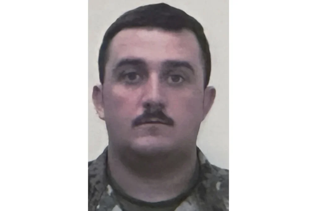 National Guard member staff Sgt. Andrew Wolfe