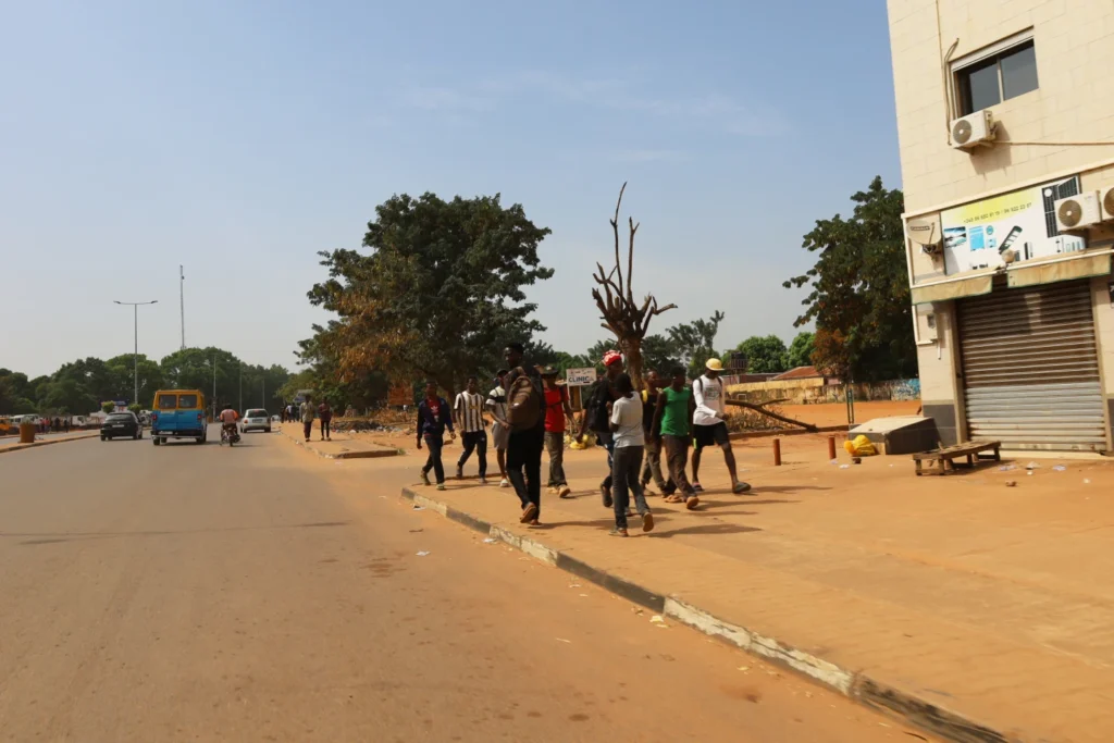 People walk on streets in Bissau, Guinea-Bissau
