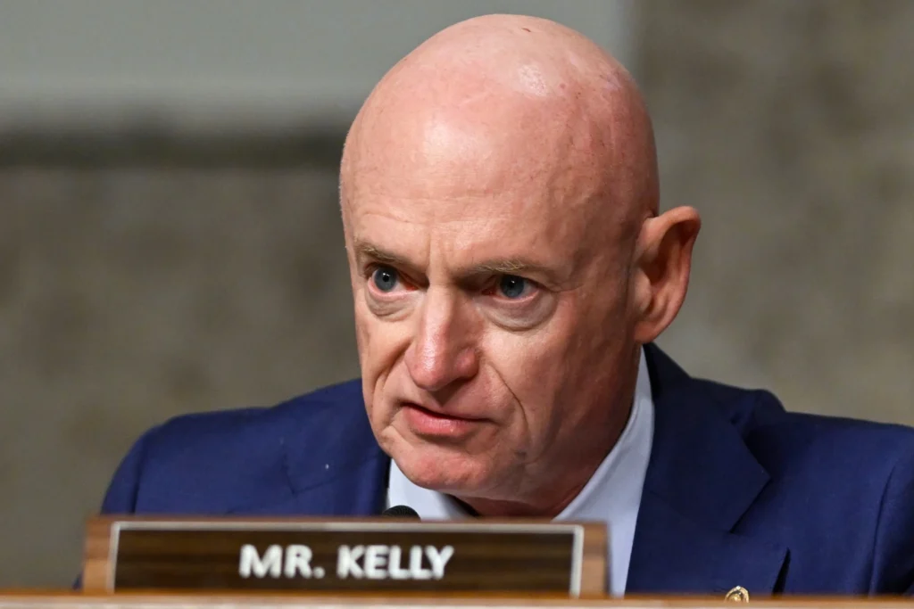 Sen. Mark Kelly speaks during the Senate Armed Services Committee confirmation hearing for Pete Hegseth, President-elect Donald Trump's choice to be Defense secretary, at Capitol in Washington