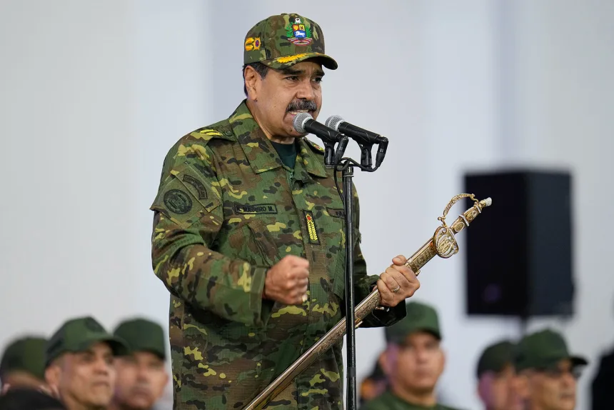 Venezuelan President Nicolas Maduro speaks during a government-organized civic-military rally in Caracas, Venezuela, Tuesday, November 25