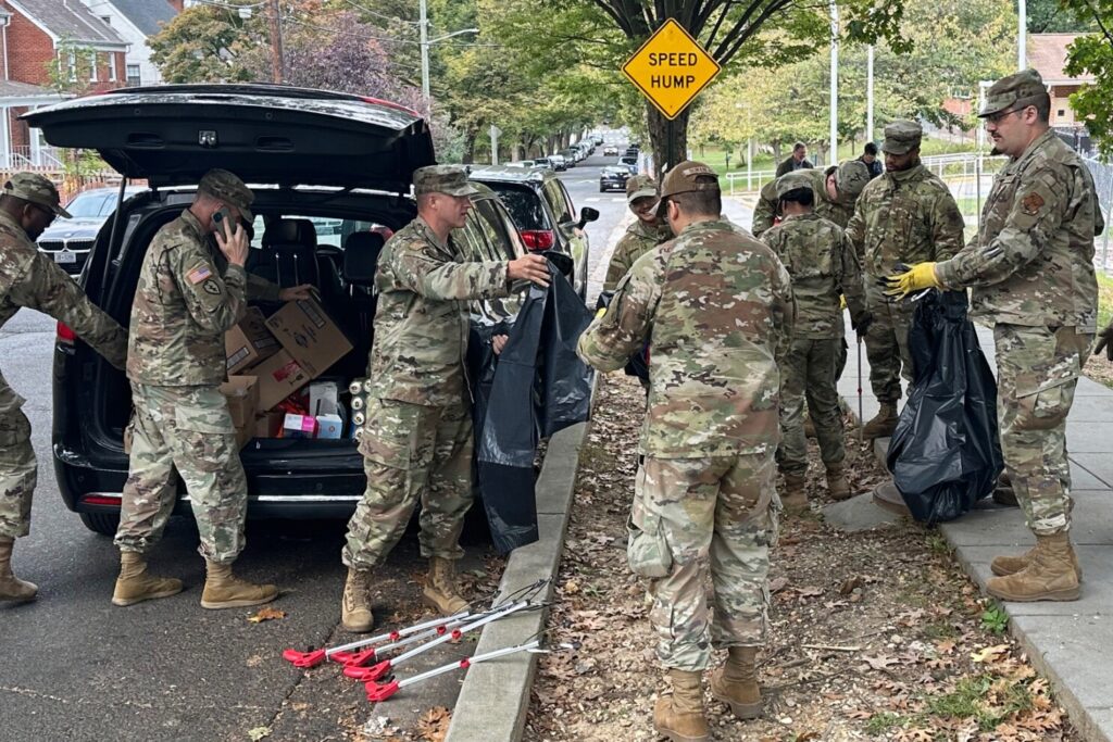 D.C. National Guard members clean up the park around Fort Stevens Recreation Center, Saturday, Oct. 11, 2025, in Washington. News of the cleanup sparked a community debate over the presence of the Guard.
