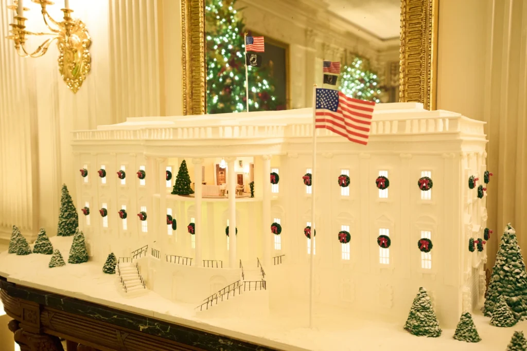 A Ginger Bread House decorates the State Dining Room of the White House during a press preview of the Christmas decorations "Home is Where the Heart Is", Monday, Dec. 1, 2025