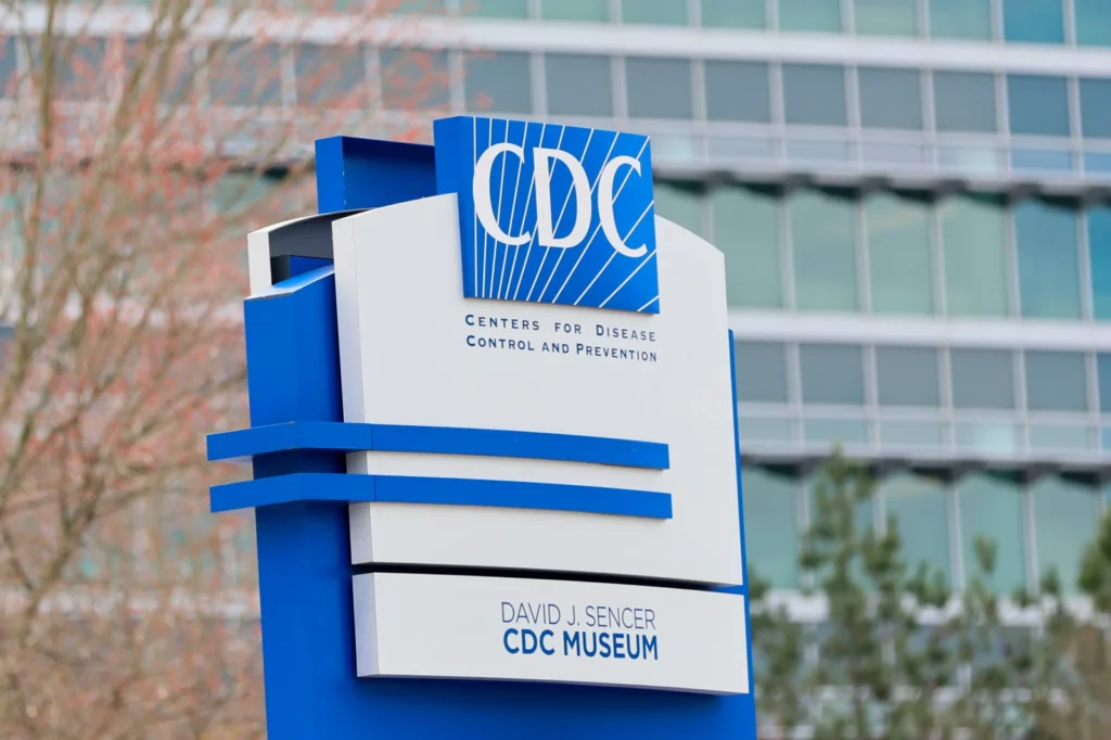 A sign with the CDC logo is displayed at the entrance to the agency’s headquarters in Atlanta on March 2, 2025.