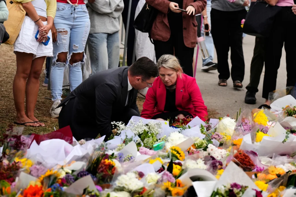 British Consul General Louise Cantillon, lays a wreath at a flower memorial for victims of Sunday’s shooting at the Bondi Pavilion at Bondi Beach on Tuesday, Dec. 16, 2025, in Sydney, Australia.