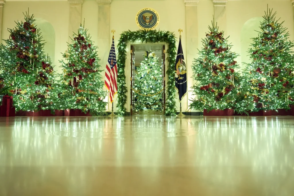 Christmas tress decorate the Cross Hall of the White House during a press preview of the Christmas decorations "Home is Where the Heart Is", Monday, Dec. 1, 2025
