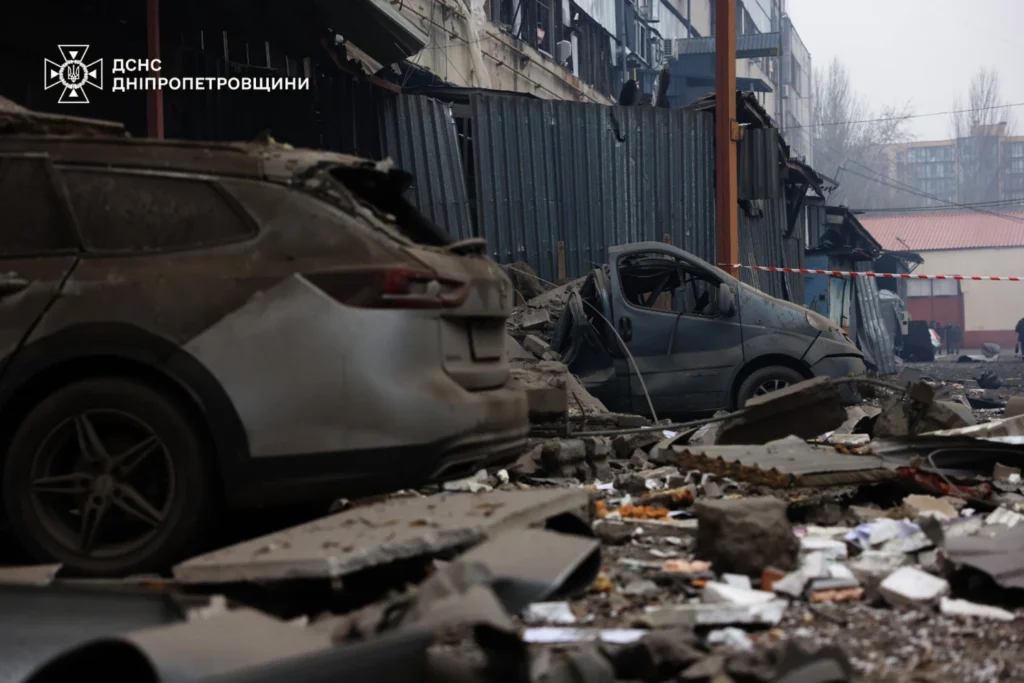 Damaged cars and debris after Russian missile attack in Dnipro, Ukraine, Monday, Dec.1, 2025
