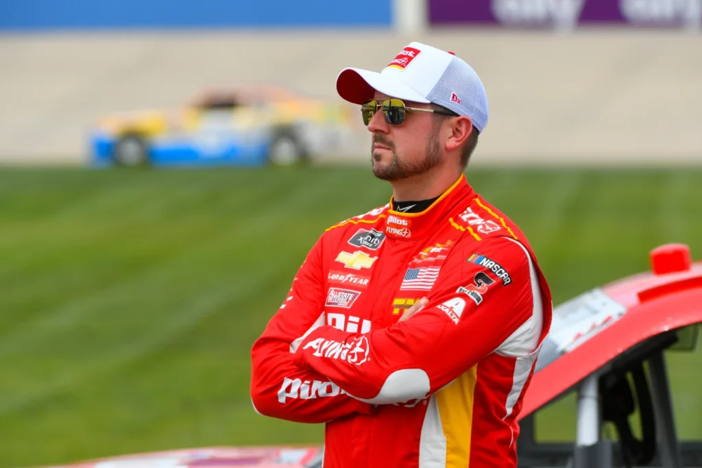 Driver Michael Annett watches the board during qualifying for the NASCAR Xfinity Series auto race in Lebanon, Tenn