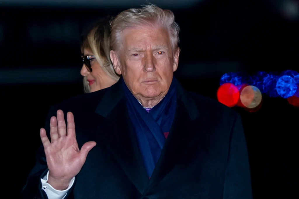 President Donald Trump waves as he and first lady Melania Trump arrive on Air Force One, Sunday, Nov 30, 2025, at Joint Base Andrews, Md.