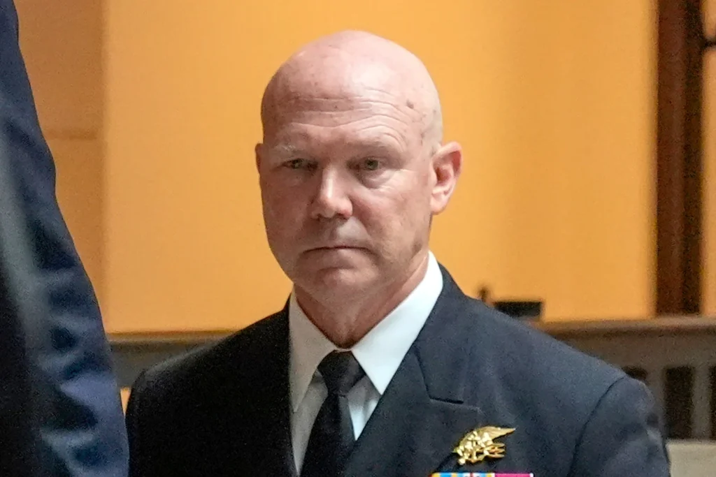 U.S. Navy Adm. Frank M. Bradley walks to a meeting with senators on Capitol Hill in Washington